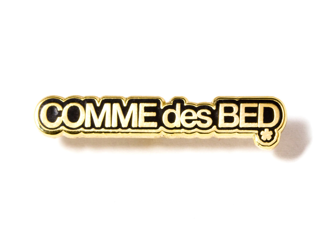 http://www.pintrill.com/collections/homepage-collection/products/comme-des-bed-pin-black-and-gold?variant=15252358596